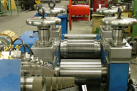 Lath machine-slitting and spreading mills